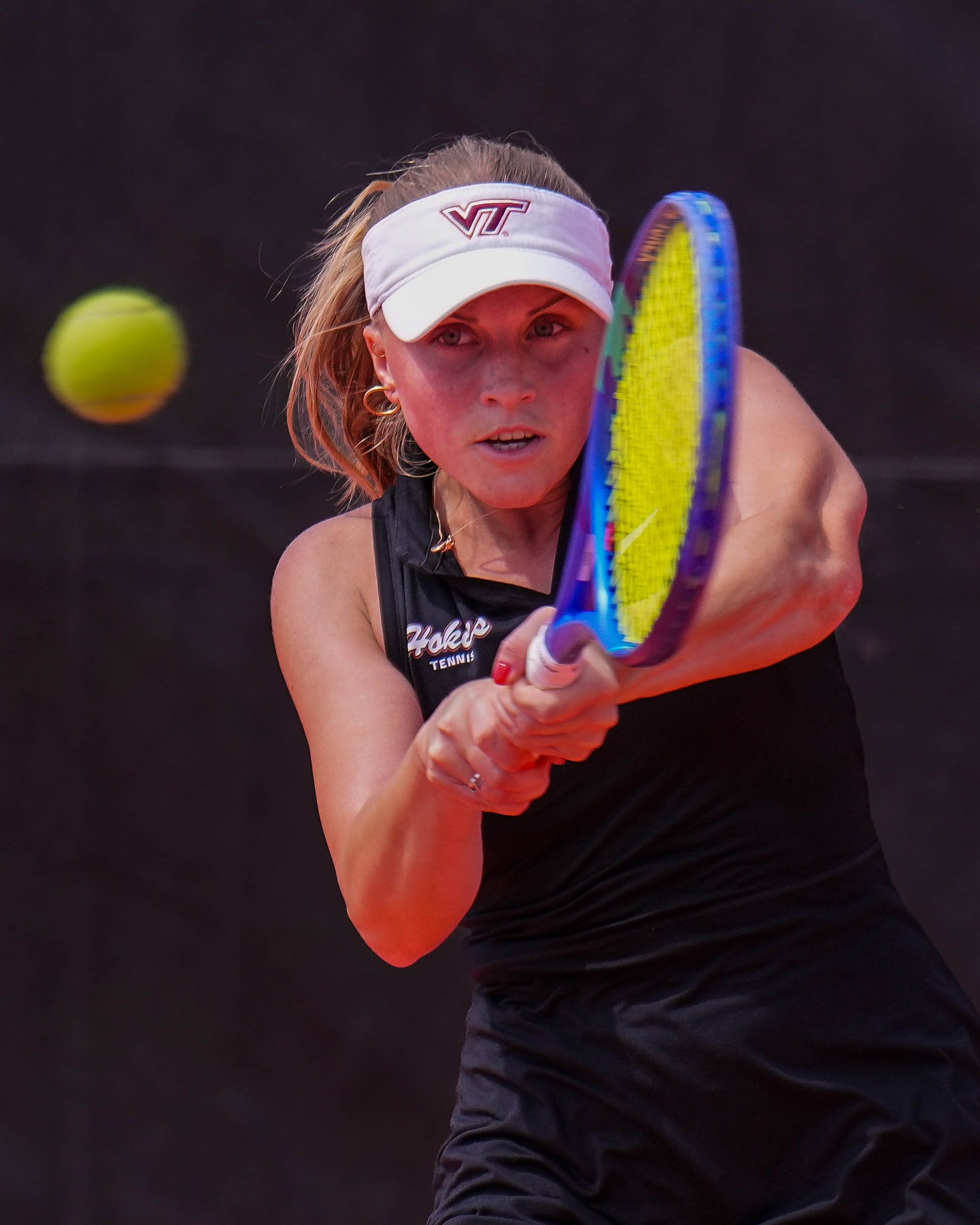 Tennis player hitting a two-handed backhand